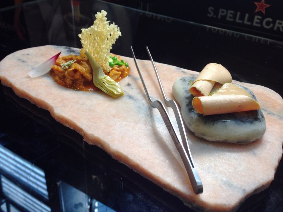 Photogallery






The S.Pellegrino Young Chef takes place in the basement of the Mall, under the Diamond Tower in via Liberazione, Milan








The kitchen area dedicated to the preparation is huge








Outdoor finishes








The twenty candidates competing in the S.Pellegrino Young Chef before the start








River, land, earth, the dish by Swiss Martin Elschner













The Swiss candidate Martin Elschner








Second from the left, Italian candidate Paolo Griffa








MENTORS. Nino Graziano, two Michelin stars in Sicily in the past, now at work in Moscow; Norwegian Eyvind Hellstrøm, the first two stars in Scandinavia (Bagatelle in Oslo, now closed) and Yoshihiro Narisawa (eighth in the World's 50Best)








The dish by American Vinson Petrillo: Squid, chorizo, agnolotti with wagyu cheeks and parsley, emulsion of squid ink








The S.Pellegrino Young chef is fashion too: some of the collections beside the ring with the chefs








The complete jury








Wylie Dufresne, a legend in creative cuisine in America, with stylist A-Morir competing for the same country








Maria José Jordan from Peru, the only woman in the competition 













Unusual dishes








Massimo Bottura and journalist Ryan King of Fine Dining Lovers








Angel Leon of restaurant Aponiente in Andalusia, mentor of the Spanish candidate, with Joan Roca, chef number one in the world according to the World's 50Best, at the helm of Celler de Can Roca in Cataluña








<p><b>Griffa</b> waits patiently for his turn (he will be the 17th of the 20 contenders) spying the work of those who come before him</p>








Irish Mark Moriarty at work (The Culinary Counter, Dublin)








The dish by David Andreas Morera, Spain-Portugal, Smoked roasted eel, onion soup, Hollandaise sauce and pickled onions 








Morarty’s dish: Celeriac baked in barley and smoked hay  























The great Japanese chef Seiji Yamamoto, Japanese mentor, at the helm of restaurant Ryugin 








Dany Stauffacher, organiser of Sapori Ticino, takes a selfie with Cristina Bowerman and Paolo Griffa








The Italian team supporting Paolo Griffa








Tripe and foie gras, Paolo Griffa’s dish





