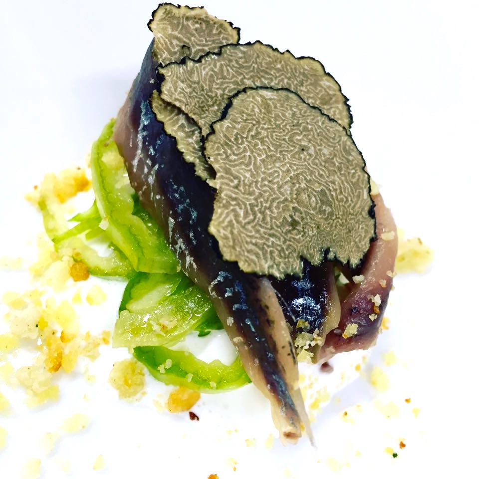 Photogallery






Enrico Crippa, Piazza Duomo, Alba (Cuneo)

Prawn and radicchio from Treviso cocktail – It’s a take on prawn cocktail with radicchio from Treviso first vacuum cooked and then opened as if it were a water lily. The prawn is seasoned with smoked pancetta cooking water. Then prawn bisque and a drop of shiso vinegar. Hence the classic dish acquires a new dimension, seasoned with choron sauce, which is basically a Béarnaise sauce with tomato









Andrea Ribaldone, I Due Buoi, Alessandria

Fassone beef agnolotti – Subtitle: “Memories of a trip to Japan”. Because I unite a true Piedmontese classic with a typical Japanese technique, soba in ice. Hence: cold agnolotti, in ice, with the intensity of the stuffing enhanced by the low temperature. I connect with the territory: not having agnolotti in the menu, in Piedmont, is blasphemy. However, I present them almost crispy. I took the recipe from my aunt, from Lu Monferrato, and remembered when as a child I would eat her agnolotti as soon as she made them, still raw and callous









Riccardo Aiachini, La Fermata, Alessandria

Chicken alla Marengo... – It’s an ancient recipe dedicated to Napoleon after the battle he won against the Austrians in June of 1800. With a contemporary take, of course









Davide Palluda, All’Enoteca, Canale (Cuneo)

Salted codf with milk and onion caramel – A veil of pungent and sweet caramel, with dried onion amplifying its flavour, on top of the salted cod cooked with milk. A sumptuous and intrigating dish, with white and milky tones, connected with my past and the history of many regions that don’t have any sea but have always been dreaming of it when cooking









Marc Lanteri, Al Castello di Grinzane, Grinzane Cavour (Cuneo)

Marco Martini’s Fassone steak tartare, light whole grain mustard mayonnaise and Parmigiano matured 30 months – This dish is a classic from the Langhe, to which I give a touch of France thanks to the light whole grain mustard mayonnaise









Barbara Scabin, Blupum, Ivrea (Torino)

L'isola galleggiante dei cugini d'Oltralpe rivisto al contrario [The floating island of the cousins from the other side of the Alps, seen upside down] – Quoting Wikipedia: it’s a relatively light and moderately sweet dessert, so much so that if prepared with the necessary attention, it can also be eaten by people suffering from diabetes, cardiac and celiac diseases









Marco Rossi, La Mugnaia, Ivrea (Torino)

Testacoda – These are cheeks cooked very slowly, tail wrapped in cabbage and fillet tataki with horseradish. In other ways, it’s Piedmontese fassone from the Langhe to Japan…









Marta Grassi, Tantris, Novara

Prospettiva nord: baccalà e culatello s’incontrano [Looking North, salted cod and culatello meet] – Two elements, two Northern regions, the former sober and simple, the latter opulent, meet and melt









Antonino Cannavacciuolo, Villa Crespi, Orta San Giulio (Novara)

Prawns, egg and tomato – My personal play with marine textures. This fake mini sunny side up egg is my south with earthly aromas such as tomato and inside a tartare of raw prawns. Red prawn from Sicily is still one of my favourite crustaceans, it’s a part of my life (photo credits Viaggiatore Gourmet)









Christian Milone, Trattoria Zappatori, Pinerolo (Torino)

Egg and eggs – Egg yolk with truffle, caviar, celery broth and parsley buttons... with herbs. There’s a world inside, it pulls down prejudgements and popular beliefs having everyone’s taste agree









Christian Meloni Delrio, Casa Baladin, Piozzo (Cuneo)

A cage made with quinoa, scampi and burrata – A simple yet flavourful dish, perfectly matched with our Wayan beer, a saison with scents of pepper









Davide Scabin, Combal.zero, Rivoli (Torino)

Saltimbocca alla Combal.zero – When you see a slice of prosciutto and some sage on top of a slice of meat you know it’s a "saltimbocca alla romana”. As of today, when you see a slice of prosciutto and some sage on a pasta lasagna (the egg-pasta must be at least 4 mm thick), you’ll know it’s a “saltimbocca alla Scabinsky”. The only variation: 3 different prosciuttos are used, one from Piedmont, one from Parma and one from Tuscany (from the great Fracassi)









Igor Macchia, La Credenza, San Mauro Torinese (Torino)

Felicetti Conchiglioni with squid ink, mussels, potatoes, chicory and candied ginger – All the flavour of Italian tradition plus the lightness of the Japanese one









Luca Zecchin, Guido da Costigliole, Santo Stefano Belbo (Cuneo)

Steamed and then roasted duck thigh with Abate pears, honey and pepper from Val di Maggia – A dish that encloses our tradition and connects our borders in Italy









Ugo Alciati, Guido, Serralunga d'Alba

Cardoons pears and anchovies – An unusual and intriguing pairing, the meeting of three Piedmontese ingredients that aren’t normally matched: hunchback cardoons from Nizza Monferrato, Madernassa pear and salted anchovy









Massimiliano Musso, Cà Vittoria, Tigliole d’Asti (Asti)

Rabbit, artichokes, liquorice and vegetal notes – I’m proud of this dish because in Piedmontese tradition roasted rabbit is always present in the Sunday lunch menu. I enriched it with a modern cooking technique (that is to say low temperature), pairing it with artichokes cooked in a vacuum with oil aromatised with toasted and blended peels and a liquorice mayo. Finally herbs, a vegetal touch coming from my kitchen garden









Claudio Vicina, Casa Vicina a Eataly, Torino

Kabuki 2013 – From 2013 onwards, it has undergone many changes. It’s a complete main course in terms of nutrients and calories. It was born as a starter in ancient times (tartrà). It then became more refined, in the shape of a pie, and today it’s a complete vegetarian dish. It’s called Kabuki because of it’s an explosion of colours, vegetables (4 or 5) and flavour. We serve it thus: a pie made with courgettes and Grana Padano matured 24 months in the centre of the dish. Finally, on top of the pie, we carefully put the egg yolk breaded with brioche crumbles fried in extra virgin olive oil









Matteo Baronetto, Del Cambio, Torino

Lasagne with sea lettuce and veal meat sauce (without tomato) – The sea lettuce lasagne is an almost natural and spontaneous version of Gualtiero Marches’s lasagne made with green pasta and pheasant meat sauce which I made again and again. It is natural and spontaneous in that the idea is not of giving a new take on the classic lasagne but a chance to a celiac to taste the primary taste of lasagne. The sea lettuce in fact shows no difference with the classic Italian green coloured pasta






