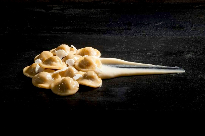 Photogallery






Enrico Crippa, Piazza Duomo, Alba (Cuneo)

Prawn and radicchio from Treviso cocktail – It’s a take on prawn cocktail with radicchio from Treviso first vacuum cooked and then opened as if it were a water lily. The prawn is seasoned with smoked pancetta cooking water. Then prawn bisque and a drop of shiso vinegar. Hence the classic dish acquires a new dimension, seasoned with choron sauce, which is basically a Béarnaise sauce with tomato









Andrea Ribaldone, I Due Buoi, Alessandria

Fassone beef agnolotti – Subtitle: “Memories of a trip to Japan”. Because I unite a true Piedmontese classic with a typical Japanese technique, soba in ice. Hence: cold agnolotti, in ice, with the intensity of the stuffing enhanced by the low temperature. I connect with the territory: not having agnolotti in the menu, in Piedmont, is blasphemy. However, I present them almost crispy. I took the recipe from my aunt, from Lu Monferrato, and remembered when as a child I would eat her agnolotti as soon as she made them, still raw and callous









Riccardo Aiachini, La Fermata, Alessandria

Chicken alla Marengo... – It’s an ancient recipe dedicated to Napoleon after the battle he won against the Austrians in June of 1800. With a contemporary take, of course









Davide Palluda, All’Enoteca, Canale (Cuneo)

Salted codf with milk and onion caramel – A veil of pungent and sweet caramel, with dried onion amplifying its flavour, on top of the salted cod cooked with milk. A sumptuous and intrigating dish, with white and milky tones, connected with my past and the history of many regions that don’t have any sea but have always been dreaming of it when cooking









Marc Lanteri, Al Castello di Grinzane, Grinzane Cavour (Cuneo)

Marco Martini’s Fassone steak tartare, light whole grain mustard mayonnaise and Parmigiano matured 30 months – This dish is a classic from the Langhe, to which I give a touch of France thanks to the light whole grain mustard mayonnaise









Barbara Scabin, Blupum, Ivrea (Torino)

L'isola galleggiante dei cugini d'Oltralpe rivisto al contrario [The floating island of the cousins from the other side of the Alps, seen upside down] – Quoting Wikipedia: it’s a relatively light and moderately sweet dessert, so much so that if prepared with the necessary attention, it can also be eaten by people suffering from diabetes, cardiac and celiac diseases









Marco Rossi, La Mugnaia, Ivrea (Torino)

Testacoda – These are cheeks cooked very slowly, tail wrapped in cabbage and fillet tataki with horseradish. In other ways, it’s Piedmontese fassone from the Langhe to Japan…









Marta Grassi, Tantris, Novara

Prospettiva nord: baccalà e culatello s’incontrano [Looking North, salted cod and culatello meet] – Two elements, two Northern regions, the former sober and simple, the latter opulent, meet and melt









Antonino Cannavacciuolo, Villa Crespi, Orta San Giulio (Novara)

Prawns, egg and tomato – My personal play with marine textures. This fake mini sunny side up egg is my south with earthly aromas such as tomato and inside a tartare of raw prawns. Red prawn from Sicily is still one of my favourite crustaceans, it’s a part of my life (photo credits Viaggiatore Gourmet)









Christian Milone, Trattoria Zappatori, Pinerolo (Torino)

Egg and eggs – Egg yolk with truffle, caviar, celery broth and parsley buttons... with herbs. There’s a world inside, it pulls down prejudgements and popular beliefs having everyone’s taste agree









Christian Meloni Delrio, Casa Baladin, Piozzo (Cuneo)

A cage made with quinoa, scampi and burrata – A simple yet flavourful dish, perfectly matched with our Wayan beer, a saison with scents of pepper









Davide Scabin, Combal.zero, Rivoli (Torino)

Saltimbocca alla Combal.zero – When you see a slice of prosciutto and some sage on top of a slice of meat you know it’s a "saltimbocca alla romana”. As of today, when you see a slice of prosciutto and some sage on a pasta lasagna (the egg-pasta must be at least 4 mm thick), you’ll know it’s a “saltimbocca alla Scabinsky”. The only variation: 3 different prosciuttos are used, one from Piedmont, one from Parma and one from Tuscany (from the great Fracassi)









Igor Macchia, La Credenza, San Mauro Torinese (Torino)

Felicetti Conchiglioni with squid ink, mussels, potatoes, chicory and candied ginger – All the flavour of Italian tradition plus the lightness of the Japanese one









Luca Zecchin, Guido da Costigliole, Santo Stefano Belbo (Cuneo)

Steamed and then roasted duck thigh with Abate pears, honey and pepper from Val di Maggia – A dish that encloses our tradition and connects our borders in Italy









Ugo Alciati, Guido, Serralunga d'Alba

Cardoons pears and anchovies – An unusual and intriguing pairing, the meeting of three Piedmontese ingredients that aren’t normally matched: hunchback cardoons from Nizza Monferrato, Madernassa pear and salted anchovy









Massimiliano Musso, Cà Vittoria, Tigliole d’Asti (Asti)

Rabbit, artichokes, liquorice and vegetal notes – I’m proud of this dish because in Piedmontese tradition roasted rabbit is always present in the Sunday lunch menu. I enriched it with a modern cooking technique (that is to say low temperature), pairing it with artichokes cooked in a vacuum with oil aromatised with toasted and blended peels and a liquorice mayo. Finally herbs, a vegetal touch coming from my kitchen garden









Claudio Vicina, Casa Vicina a Eataly, Torino

Kabuki 2013 – From 2013 onwards, it has undergone many changes. It’s a complete main course in terms of nutrients and calories. It was born as a starter in ancient times (tartrà). It then became more refined, in the shape of a pie, and today it’s a complete vegetarian dish. It’s called Kabuki because of it’s an explosion of colours, vegetables (4 or 5) and flavour. We serve it thus: a pie made with courgettes and Grana Padano matured 24 months in the centre of the dish. Finally, on top of the pie, we carefully put the egg yolk breaded with brioche crumbles fried in extra virgin olive oil









Matteo Baronetto, Del Cambio, Torino

Lasagne with sea lettuce and veal meat sauce (without tomato) – The sea lettuce lasagne is an almost natural and spontaneous version of Gualtiero Marches’s lasagne made with green pasta and pheasant meat sauce which I made again and again. It is natural and spontaneous in that the idea is not of giving a new take on the classic lasagne but a chance to a celiac to taste the primary taste of lasagne. The sea lettuce in fact shows no difference with the classic Italian green coloured pasta









Marcello Trentini, Magorabin, Torino

Puntarelle/Burrata/Anchovies- A delicious and complex snack uniting North and South... Hanging in the balance between bitter, sapid, sweet and umami









Alessandro Mecca, Spazio 7 – Torino

Pork belly, apple, oyster and ear – A journey across strong and delicate flavours, where the tradition of my territory is renewed in the dish by meeting the sea (photo by Edoardo Gatti)









Stefano Borra, Vo, Torino

Jerusalem artichoke cooked in two ways, cardoons au gratin, rabbit meat sauce, white truffle – My bagna caoda, served in a "balon”






