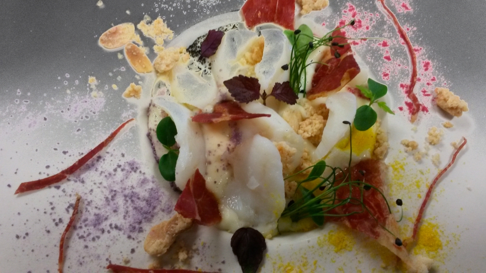 Photogallery






Enrico Crippa, Piazza Duomo, Alba (Cuneo)

Prawn and radicchio from Treviso cocktail – It’s a take on prawn cocktail with radicchio from Treviso first vacuum cooked and then opened as if it were a water lily. The prawn is seasoned with smoked pancetta cooking water. Then prawn bisque and a drop of shiso vinegar. Hence the classic dish acquires a new dimension, seasoned with choron sauce, which is basically a Béarnaise sauce with tomato









Andrea Ribaldone, I Due Buoi, Alessandria

Fassone beef agnolotti – Subtitle: “Memories of a trip to Japan”. Because I unite a true Piedmontese classic with a typical Japanese technique, soba in ice. Hence: cold agnolotti, in ice, with the intensity of the stuffing enhanced by the low temperature. I connect with the territory: not having agnolotti in the menu, in Piedmont, is blasphemy. However, I present them almost crispy. I took the recipe from my aunt, from Lu Monferrato, and remembered when as a child I would eat her agnolotti as soon as she made them, still raw and callous









Riccardo Aiachini, La Fermata, Alessandria

Chicken alla Marengo... – It’s an ancient recipe dedicated to Napoleon after the battle he won against the Austrians in June of 1800. With a contemporary take, of course









Davide Palluda, All’Enoteca, Canale (Cuneo)

Salted codf with milk and onion caramel – A veil of pungent and sweet caramel, with dried onion amplifying its flavour, on top of the salted cod cooked with milk. A sumptuous and intrigating dish, with white and milky tones, connected with my past and the history of many regions that don’t have any sea but have always been dreaming of it when cooking









Marc Lanteri, Al Castello di Grinzane, Grinzane Cavour (Cuneo)

Marco Martini’s Fassone steak tartare, light whole grain mustard mayonnaise and Parmigiano matured 30 months – This dish is a classic from the Langhe, to which I give a touch of France thanks to the light whole grain mustard mayonnaise









Barbara Scabin, Blupum, Ivrea (Torino)

L'isola galleggiante dei cugini d'Oltralpe rivisto al contrario [The floating island of the cousins from the other side of the Alps, seen upside down] – Quoting Wikipedia: it’s a relatively light and moderately sweet dessert, so much so that if prepared with the necessary attention, it can also be eaten by people suffering from diabetes, cardiac and celiac diseases









Marco Rossi, La Mugnaia, Ivrea (Torino)

Testacoda – These are cheeks cooked very slowly, tail wrapped in cabbage and fillet tataki with horseradish. In other ways, it’s Piedmontese fassone from the Langhe to Japan…






