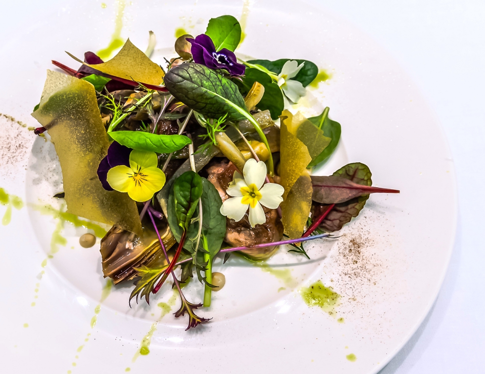 Photogallery






Enrico Crippa, Piazza Duomo, Alba (Cuneo)

Prawn and radicchio from Treviso cocktail – It’s a take on prawn cocktail with radicchio from Treviso first vacuum cooked and then opened as if it were a water lily. The prawn is seasoned with smoked pancetta cooking water. Then prawn bisque and a drop of shiso vinegar. Hence the classic dish acquires a new dimension, seasoned with choron sauce, which is basically a Béarnaise sauce with tomato









Andrea Ribaldone, I Due Buoi, Alessandria

Fassone beef agnolotti – Subtitle: “Memories of a trip to Japan”. Because I unite a true Piedmontese classic with a typical Japanese technique, soba in ice. Hence: cold agnolotti, in ice, with the intensity of the stuffing enhanced by the low temperature. I connect with the territory: not having agnolotti in the menu, in Piedmont, is blasphemy. However, I present them almost crispy. I took the recipe from my aunt, from Lu Monferrato, and remembered when as a child I would eat her agnolotti as soon as she made them, still raw and callous









Riccardo Aiachini, La Fermata, Alessandria

Chicken alla Marengo... – It’s an ancient recipe dedicated to Napoleon after the battle he won against the Austrians in June of 1800. With a contemporary take, of course









Davide Palluda, All’Enoteca, Canale (Cuneo)

Salted codf with milk and onion caramel – A veil of pungent and sweet caramel, with dried onion amplifying its flavour, on top of the salted cod cooked with milk. A sumptuous and intrigating dish, with white and milky tones, connected with my past and the history of many regions that don’t have any sea but have always been dreaming of it when cooking









Marc Lanteri, Al Castello di Grinzane, Grinzane Cavour (Cuneo)

Marco Martini’s Fassone steak tartare, light whole grain mustard mayonnaise and Parmigiano matured 30 months – This dish is a classic from the Langhe, to which I give a touch of France thanks to the light whole grain mustard mayonnaise









Barbara Scabin, Blupum, Ivrea (Torino)

L'isola galleggiante dei cugini d'Oltralpe rivisto al contrario [The floating island of the cousins from the other side of the Alps, seen upside down] – Quoting Wikipedia: it’s a relatively light and moderately sweet dessert, so much so that if prepared with the necessary attention, it can also be eaten by people suffering from diabetes, cardiac and celiac diseases









Marco Rossi, La Mugnaia, Ivrea (Torino)

Testacoda – These are cheeks cooked very slowly, tail wrapped in cabbage and fillet tataki with horseradish. In other ways, it’s Piedmontese fassone from the Langhe to Japan…









Marta Grassi, Tantris, Novara

Prospettiva nord: baccalà e culatello s’incontrano [Looking North, salted cod and culatello meet] – Two elements, two Northern regions, the former sober and simple, the latter opulent, meet and melt









Antonino Cannavacciuolo, Villa Crespi, Orta San Giulio (Novara)

Prawns, egg and tomato – My personal play with marine textures. This fake mini sunny side up egg is my south with earthly aromas such as tomato and inside a tartare of raw prawns. Red prawn from Sicily is still one of my favourite crustaceans, it’s a part of my life (photo credits Viaggiatore Gourmet)









Christian Milone, Trattoria Zappatori, Pinerolo (Torino)

Egg and eggs – Egg yolk with truffle, caviar, celery broth and parsley buttons... with herbs. There’s a world inside, it pulls down prejudgements and popular beliefs having everyone’s taste agree









Christian Meloni Delrio, Casa Baladin, Piozzo (Cuneo)

A cage made with quinoa, scampi and burrata – A simple yet flavourful dish, perfectly matched with our Wayan beer, a saison with scents of pepper









Davide Scabin, Combal.zero, Rivoli (Torino)

Saltimbocca alla Combal.zero – When you see a slice of prosciutto and some sage on top of a slice of meat you know it’s a "saltimbocca alla romana”. As of today, when you see a slice of prosciutto and some sage on a pasta lasagna (the egg-pasta must be at least 4 mm thick), you’ll know it’s a “saltimbocca alla Scabinsky”. The only variation: 3 different prosciuttos are used, one from Piedmont, one from Parma and one from Tuscany (from the great Fracassi)









Igor Macchia, La Credenza, San Mauro Torinese (Torino)

Felicetti Conchiglioni with squid ink, mussels, potatoes, chicory and candied ginger – All the flavour of Italian tradition plus the lightness of the Japanese one









Luca Zecchin, Guido da Costigliole, Santo Stefano Belbo (Cuneo)

Steamed and then roasted duck thigh with Abate pears, honey and pepper from Val di Maggia – A dish that encloses our tradition and connects our borders in Italy









Ugo Alciati, Guido, Serralunga d'Alba

Cardoons pears and anchovies – An unusual and intriguing pairing, the meeting of three Piedmontese ingredients that aren’t normally matched: hunchback cardoons from Nizza Monferrato, Madernassa pear and salted anchovy






