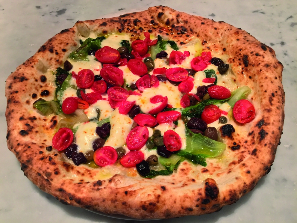 Galleria fotografica






Patrick Ricci, Pomodoro & Basilico, San Mauro Torinese (Torino)

Emozioni - Foie gras con criollo 100%, mostarda di fichi e mousse al caffè. Sottotitolo, l'amore in un morso. Resta in bocca un gusto finale di amaro e dolce, è un po' la sensazione che si prova quando si vive un amore, ma nei momenti un po' tristi, dopo una lite o quando non è corrisposto – foto Luca Appiotti









Simone Lombardi, Dry, Milano

Pizza anguilla al cartoccio, cime di rapa e provola affumicata - Un piatto dalla prevalente nota affumicata data dalla cottura dell’anguilla nel forno a legna. Le cime di rapa ne risaltano: sapidità, grassezza e tendenza amarognola









Leonardo Giannico, Taverna Gourmet, Milano

Pizza polipo e cime di rapa, impasto al nero di seppia – Con vellutata di broccoli calabresi cime di rapa e polipo alla plancia, il tutto accompagnato da un bicchierino di acqua di polipo, lime e pepe nero, per sciacquare la bocca e accompagnare la pizza









Antonio Pappalardo, La Cascina dei Sapori, Rezzato (Brescia)

Pizza da degustazione con tagliatelle di seppia, caco, noce macadamia e frutto della passione - L'abbiamo proposta in anteprima per la serata di beneficienza che abbiamo organizzato a favore della fondazione PInAC ed è piaciuta molto. L'ho creata insieme al mio secondo Matteo Attianese, perché abbiamo visto che in precedenza abbiamo proposto la seppia in alcune pizze ma sempre con poco successo. Quindi cambiando forma alla seppia (prima cotta sottovuoto e poi tagliata con l'affettatrice a mó di tagliatella) ho notato che è stata molto apprezzata









Denis Lovatel, Da Ezio, Alano di Piave (Belluno)

In-fusioni - La pizza inaugura un progetto al quale tengo molto, prevede la creazione di 12 pizze d'autore ideate insieme ad altrettanti importanti chef. Ne proporremo una al mese qui Da Ezio. Questo mese partiamo con una pizza creata insieme a Francesco Brutto di Undicesimo Vineria, premiato di recente come Miglior Chef Emergente del Nordest. Insieme abbiamo pensato una pizza bianca con fiordilatte, topinambur al forno, chips di cavolo nero, succo di cavolo nero, noci e infuso di Pu'er, un particolare tè post-fermentato cinese della regione della Yunnan, che più invecchia e più migliora. Sulla pizza usiamo un Pu'er del 1998 con sentori di noce, cantina, terra e corteccia. In generale è una pizza che gioca sull'armonia e non sui contrasti, i gusti si richiamano a vicenda









Alberto Morello, Gigi Pipa, Este (Padova)

Gennaio nell'orto - La verdura è ovviamente di nostra produzione (broccolo verde, finocchio con aneto, cipolla caramellata, spuma di spinaci e parmigiano, chips di broccolo fiolaro)









Ruggero Ravagnan, Grigoris, Mestre (Venezia)

Cavolo che sarda! - Fiordilatte, cavolo nero, sarda al forno, peperoncino fresco, pane croccante di Petra9, finocchietto









Simone Padoan, I Tigli, San Bonifacio (Verona)

Pizza raperonzoli e pasta di salame - Perché per me è la perfetta trasposizione di ricordi di infanzia in un piatto moderno, capace di attualizzare sapori tradizionali tipici di questo periodo









Renato Bosco, Saporè, San Martino Buon Albergo (Verona)

Aria Affumicata - Aria di pane cotta al vapore con renga affumicata e con crema calda di broccoletto di Custoza. Tradizioni e usanze della cucina veronese vogliono essere riportate in chiave attuale presentando un piatto che si troverà a Saporè nel periodo quaresimale. In molti paesi del Veronese si festeggia la renga (pesce povero) in concomitanza con il mercoledì delle ceneri. Sacro e profano si mescolano









Matto Aloe, Berberè, Bologna (anche Castelmaggiore e Firenze)

Pizza 'nduja di Spilinga, pomodoro, caciocavallo. Una pizza che ha preso posto nei menu di tutte le stagioni in Berberè. Un'evergreen caldo, deciso e accogliente: una pizza del sud









Massimo Gatti, I Due Gatti, Borgo Val di Taro (Parma)

Pizza Don Camillo. E' una delle pizze che comporrà il menu della nuova pizzeria al taglio Pizza di Parma, in posizione centralissima a Parma (apertura entro marzo) che proporremo lungo l'anno con cadenza mensile, per giocare anche con prodotti fuori del nostro territorio in maniera accattivante. E' ispirata alle scorribande e ai luoghi del personaggio di Guareschi: spalla cotta di San Secondo, la crema di Parmigiano-Reggiano (tratto d'unione tra le due province) e le cipolline Borettane (Boretto è un paese nei pressi di Brescello, dove venne sviluppata la storia di Don Camillo) cotte nella Fortana, vino tipico della Bassa Parmense e Reggiana 









Gabriele Bonci, Pizzarium, Roma

Pizza carbonara di carciofi. Una focaccia di cipolle dolci, con sopra una strapazzata di uovo, guanciale e pecorino. Rifinita con qualche carciofo, alla giudia e alla romana. L'ho dedicata a tutte quelle persone che ogni giorno vengono da tutto il mondo per assaggiare la mia pizza. Un boccone di romanità all'ennesima potenza









Stefano Callegari, Sforno, Roma

Bruschetta culo e camicia. Fetta di pane tostato con un velo di burro Occelli, uovo Parisi in camicia e una fetta di culatello Spigaroli sopra. La presenterò da Sbanco, il mio nuovo locale, apertura marzo 2016









Franco Pepe, Pepe in Grani, Caiazzo (Caserta)

Pizza Bucolica. L'ispirazione nasce da un'antica ricetta campana. Alla zucca ed ai fagioli si uniscono il sapore deciso della scamorza affumicata e la nota croccante del radicchio






