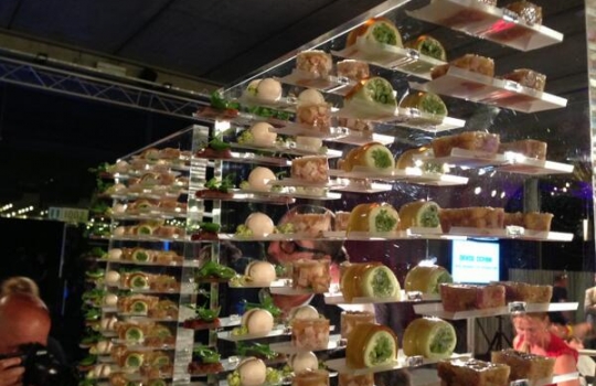 Photogallery






With 250thousand inhabitants, Gent (or Gand) is the third largest city in Belgium. With its canals and its laid back life, it competes with Bruges for the title most beautiful city in the Flanders 








The Sunday began at the Flemish Food Fest, a festival in which everyone was grilling all sorts of food. In the photo, the chef table with many of the chefs that were to be the protagonists of the Gelinaz! dinner








Colagreco, Redzepi and the kitchen-van. The location was kept secret until the beginning of the show, at around 7 pm








The two long tables set at the Icc in Gent. Three shifts: 1-8, 9-16, 17-24. We were so lucky we enjoyed them all








In the kitchen, works to dismember the chickens from Gent begin








"Even I don’t know what will happen tonight. And please remember: this is a performance, not a dinner", says Andrea Petrini, founder and curator of the event named after chef Fulvio Pieran-gelinaz and by Gorillaz, the temporary band that Blur’s Damon Albarn creates whenever he feels like it. The black sculpture underneath the Madonna is that of    Philippe Édouard Cauderlier (Antwerp, 1812-1887)








It all starts by quoting Kubrick and Eyes Wide Shot... Each dish is a song. And each of the three acts is separated by various artistic performances. In the dining room, men act as nothing is going on in front of their partners








First dish of the Gelinaz evening, Philippe Edouard Cauderlier’s Cold-hot chicken timbale, the original recipe from     1861. Roger Souvereyns of Scholteshof in Stevoort had the honour of performing it at the Icc in Gent








Inaki Aizpitarte     ’s Royal chicken kir, using all the ingredients in the original recipe. The wine is diluted in the chicken stock. The dish arrives together with     Wu Tang Clan’s rap








Anataoly Komm of Varvary in Moscow, lets us taste his Maki Roll behind the scenes








Komm’s Maki roll: chicken and vegetables wrapped in a turnip leaf. The sauce is made with walnuts, a Caucasian tradition








Agata Felluga ’s Lotus timbale. She’s the Italian sous chef at Chateaubriand in Paris, with a previous experience at Pascal Barbot’sAstrance. The dish is inspired by a Japanese sticky rice recipe, where the rice is cooked in a lotus leaf. Here, instead, there’s    Cauderlier’s chicken, together with miso, tamarind syrup, pork fat, soy sauce. A very complex dish.








Left, 32 year old Agata Felluga, born in Rome and adopted by the Ville Lumiére








Petter Nilsson’s Bread chicken, from the Gazzetta in Paris. It is made with all the cereals hens eat during their life: corn, hulled wheat, barley, rye and wheat. The photo of the bag is a portrait of the Danish chef’s creation








Massimo Bottura     is not in Gent, however, in a coup de theatre, his brother Paolo takes his place, here on the left with Alberto Buratti,     pastry-chef at Osteria Francescana. The chef from Modena explains in a video the reason behind his absence: "In Modena, his team is so finely     tuned that even my car-salesman brother can take my place", he jokes








Even in Bottura’s dish there’s no traditional chicken: it’s called Chicken, chicken, where are you? It is the re-interpretation     of the classic chicken salad, with a stock made with roasted chicken below, and a cotechino (cooked pork sausage) and agar-agar gelatine with very small dices of peas, carrots, potatoes, red and yellow peppers, onions, tomatoes... in the background, "What about the noise?" by    John Cage strikes us








Pea tendrils with chicken and mint aspic     by Blaine Wetzel, once a pupil of Redzepi, today back home in Lummi Island, a paradise in the middle of nowhere, in     Washington state. The tendrils are grilled. A great dish, with a super balance between smoke, balsamic and acid notes








Chia and chicken with tiger milk, turnips and coca leaves , that is to say "The chicken of Gent meets South America", a journey of the mind, from the Pacific ocean to the Andes to the Amazon forest led by Peruvian    Virgilio Martinez








Virgilio Martinez     at work with Alberto Buratti








Chicken liver, scallion with tarragon, turnip and toasted cauliflower stock by Basque Josean Alija








French-Spanish journalist Maria Canabal and Josean Martinez Alija








Poulet-mayo by Bertrand Grébaut of   Septime in Paris, a cold entrée with all the ingredients of the original recipe. In the background, Rufus Thomas ’s r 'n' b with "Do the funky chicken"








Reneè Redzepi has no doubt when it comes to which is the best part of the chicken: the skin. Half of the guest, as it turned out, agreed with him








Redzepi, on the left, explains his passion for chicken, discovered when he was a child in Macedonia. "I had to prepare this dish at home because it is fucking complicated"








Here it is: it’s not exactly chicken skin, but the “skin” made with a stock prepared using all the ingredients in Cauderlier’s recipe, removing the froth. A single, fantastic morsel, one of the many intervals that compose the first part of a dinner at Noma








We peek into the iPad of Italian Emilia Terragni who works for Phaidon in London, and is sitting at the table next to     ours, and we see a juicy preview: the triple format of Renè Redzepi’s next book, which will be out in November. It’s a sort of diary, an     intimate one, too, in which he explains how difficult dealing with the limelight is





