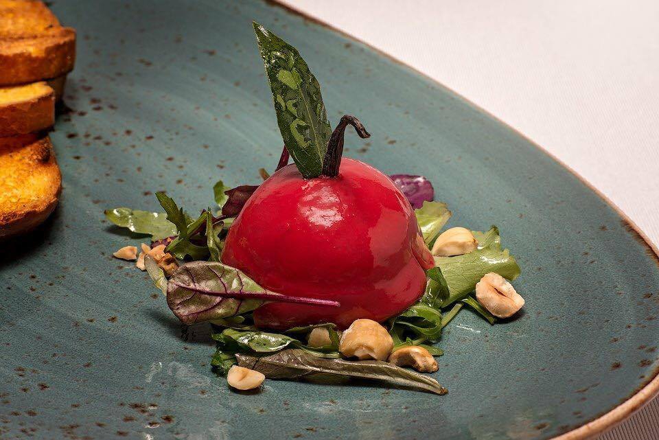 Photogallery






Iside De Cesare, La Parolina, Acquapendente (Viterbo)

Cod, garlic, oil and chilli pepper









Gianfranco Pascucci, Pascucci al Porticciolo, Fiumicino (Rome)

Eel tortelli in a broth of miso and caviar. Lake of Burano, WWF oasis: eel, myrtle and lentiscus. We’re collaborating with the WWF oases to give a "taste" to these places (photo by Andrea Di Lorenzo)









Claudio Petrolo, Claudio Petrolo, Gaeta (Latina)

Sea essence. Raw and cooked elements start an explosion with the flavour of the sea









Marco Bottega, Aminta resort, Genazzano (Rome)

Salmon, green apple and Orient spices. A meeting of sour, bitter, sweet and savoury









Rocco de Santis, Il Vistamare del Fogliano hotel, Latina

Red mullet in bread crust. A snack you can also eat with your hands, enclosing the scents of the South (I’m from Salerno): it’s like biting the sea together with onion, garlic, mint, lemon scents, raisins and pine nuts









Daniele Usai, Il Tino, Ostia (Rome)

Gnocchi with mandarin, with cod tripe and spinach. A historic dish from our menu has just returned in a current version









Gino Pesce, Acqua Pazza, Ponza (Latina)

Candele, cheese, pepper, white fish and courgettes. Created for a project we presented at Expo Milano with the goal of enhancing all the POD products of Lazio









Maurizio e Sandro Serva, La Trota, Rivodutri (Rieti)

Crayfish, roots, tubers, watercress with smoked trout and lake whitefish roe. A concentrate of flavours and lightness: roots, tubers and crayfish are steamed with aromatised water, with vegetable peels and Matcha tea. There’s no salt: the sapidity is giveb by the roe, the smokiness of the trout and the minerals in the vegetables and in the watercress, picked from our brook









Andrea Fusco, Giuda Ballerino, Rome

Venison sirloin with its jus and hibiscus, caramelised onions with blueberries and pistachio wafer. Serving a rich and lean red meat that is rarely served in this season









Cristina Bowerman, Glass Hostaria, Rome

Pasta and potatoes. Four different types of potatoes, with 4 different cooking methods, from mashed to crispy. Inspired by Bottura’s Compression of pasta and beans 









Anthony Genovese, Il Pagliaccio, Rome

Oyster, beetroot and coffee, snow of burrata. A journey across different scents, temperatures and textures









Francesco Apreda, Imàgo dell'hotel Hassler, Rome

Tandoori duck breast, cocoa earth and dried apricots. My personal take of a great classic from a continent I’m very fond of









Arcangelo Dandini, L'Arcangelo, Rome

My cipollata: zita with onion fondant with three spices. Taken from the Renaissance cipollata of Bartolomeo Scappi, the secret chef of 6 popes, who lived almost 30 years in Rome
 









Heinz Beck, La Pergola, Rome

S Campo. It’s the interpretation, with a modern take, of minestrone, made with lyophilisation. Each vegetable is cooked in the most suitable way so as to maintain its nutritional characteristics and then lyophilised. The result is 6, 7, 8 powders which are then put in the dish. The dish is served with scampi breaded with potatoes and soaked in front of the guest with a jus of this crustacean (photo by Janez Puksic)









Alba Esteve Ruiz, Marzapane, Rome

Chestnut cappeletti, raisins, smoked herring and seaweed infusion. Contrasts: the soft chestnut filling and a very persistent flavour, the smokiness and the fatness of the eel, the intense sweetness of the raisins, the sapidity of the seaweed infusion, the crispiness of the pasta...









Marco Baccanelli e Francesca Barreca, Mazzo, Rome

Roasted quails, baked tubers and roots, herb butter. The quails are served in their original shape, without deboning them. Our cuisine is moving towards a greater simplicity, and we can do so even by choosing classic yet not simple techniques









Roy Caceres, Metamorfosi, Roma

Mushrooms, flax brittle, black garlic and cream with Monviso blue cheese. In the seeming simplicity of an ingredient like mushrooms, contrasting textures give life to a dish in which their identity is surprisingly enhanced

 









Davide Del Duca, Osteria Fernanda, Rome

Snails, radish roots, Purgatorio beans, leaves and mustard seeds. A tribute to the material and primordial essence of the “earth” concept









Luciano Monosilio, Pipero al Rex, Rome

Vermicelli creamed in chicken broth, toasted spices and parmesan infusion. This recipe comes from spaghetti creamed in a very normal broth. The spices recall high mountains with the balsamic note counterbalanced by the sweet water of the parmesan. Almost like ramen









Marco Martini, Stazione di Posta, Rome

Steamed raviolo, chicken and broth of roasted potatoes. A meeting of east, west and my mother’s home









Francesco Sposito, Taverna Estia, Brusciano (Naples)

Tortellini with dandelion in a consommé of crustaceans. Introduced only recently, I’m very happy with it because it sums up the course we’ve taken






