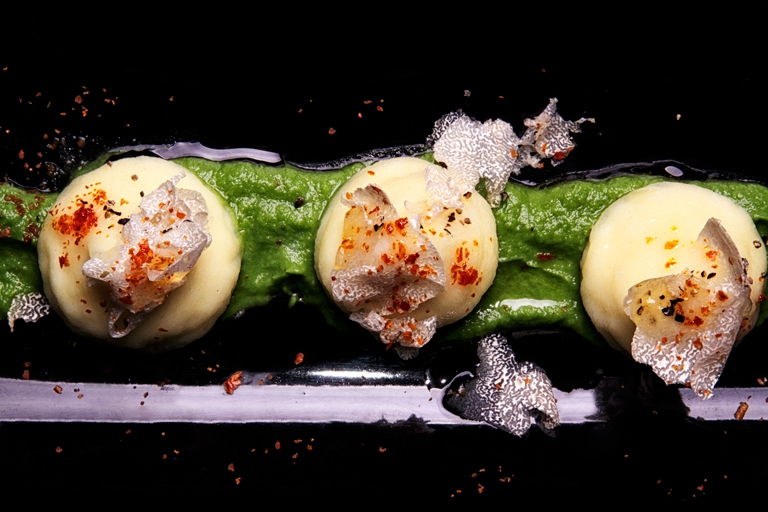 Photogallery






Gianni Dezio, Tosto, Atri (Teramo)

Tortelli with artichokes, fondue of pecorino from Atri, mint and liquorice. Liquorice and mint unite so as to enhance one of the most important vegetables in Italian cuisine









Valerio Centofanti, L'Angolo d'Abruzzo, Carsoli (L'Aquila)

Pappardelle with gelded lamb with pecorino from Alta Valle del Turano. The lamb is gelded before it is two months’ old and raised for 18 months. A dish full of emotions and sensations that has disappeared from Italian kitchens (in the picture, the gelded lamb)









Niko Romito, Reale Casadonna, Castel di Sangro (L'Aquila)

Because it’s the proof that constant research in the kitchen (in this case applied to cutting and macerating cabbage) can pull down the "wall" of vegetal representation and give new and powerful solutions in terms of structure and taste. Creating surprise and deep emotion. For me, it represents a new phase









Mattia Spadone, La Bandiera, Civitella Casanova (Pescara)

Vegetables cooked in salt. I worked on cooking in salt only using vegetables (from our kitchen garden). It may seem banal but I’ve been working on this for over 3 months: these are roots and leaves presented in different textures, crispy, mashed and thinly diced









Patrizia Corradetti, Zenobi, Colonnella (Teramo)

Meat and spinach ravioli with Neapolitan genovese sauce. I needed to include in the mid-August menu a first course with filled pasta that would still be traditional









Nadia Moscardi, Elodia nel Parco, L'Aquila

Textures of pasta and vegetable garden. It is inspired by Le Virtù, an ancient soup from Abruzzo that was made by the bride for the future mother-in-law to prove her virtues in the kitchen










William Zonfa, Magione Papale, L'Aquila

Castratissimo. Gelded meat is very popular in Abruzzo. The sauce you see is a dehydrated “veil of gelded meat sauce”, wrapping the soft meat. Upon contact with the heat and humidity of the meat, it is rehydrated and gives life to the memory of meat chops coming out from the sauce itself









Cinzia Mancini, Bottega Culinaria Biologica, San Vito Chietino (Chieti)

Pescatrice noir. My territory and the elements defining it: sun, rocks, sea, wind and fire









Stefania Di Pasquo, Locanda Mammì, Agnone (Isernia)

Raspberry mousse with caramelised white chocolate and hazelnuts. It’s a non-sweet sweet, a dessert that represents a change from the classic desserts I have in the menu. It represents my current desire for change









Felice Sgarra, Umami, Andria

Cream of cannellini beans and scampi with lemon sourness. A fresh course but also one that is suitable for every occasion
 









Antonio Scalera, La Bul, Bari

Home-smoked mackerel, toasted walnuts, jam and gelatine of friggitelli peppers. Blue tailed fish: poor, from the tradition and history of Apulia. Cinderella becomes the queen on our table









Giovanni Lorusso, Memory resort, Bisceglie (Barletta, Andria e Trani)

Sea bass, smoked Jerusalem artichoke, green affilla and sesame praliné. The fish, the aroma of almonds, the sauce of smoked Jerusalem artichoke, the aroma of the baby peas that have just sprouted and the sesame praliné adding sweetness and balsamic notes









Teresa Galeone Buongiorno, Già Sotto l'Arco, Carovigno (Brindisi)

Pink gnocchi with pesto heart, ricotta and puffed beetroot. A voluptuous mix of colours and flavours






