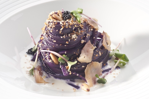 Linguine cooked in red cabbage extract, burrata, herring, pine nu