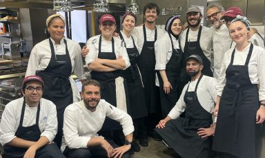 Massimo Bottura (third from the right) with some interns and staff members at Osteria Francescana in Modena. Left to right, Yaman Yesikaya, Melissa Bossou, Gabriele Currò, Cecilia Cabral, Elena Sofia Schiassi, Matteo Zonarelli (sous chef), Elifnur Ocak, Federico Fulceri, Salvatore Gianninò, Clement Gaudin (half-hidden) and Doina Paulescu (pastry chef) (photo Zanatta)
