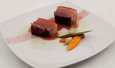 Wild pig smoked pancetta with beer with plum sauce and glazed carrots by Alessio Cancedda, sous chef of the restaurant S'Apposentu in Siddi in Sardinia, the youngest among the finalists of the Premio Birra Moretti Grand Cru