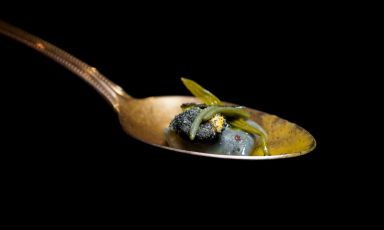 A spoon with one of the ravioli from Un coniglio al mare, a dish from the Parallels Experience menu at Il Pagliaccio in Rome. Chef Anthony Genovese is in a state of grace. Photo Tanio Liotta
