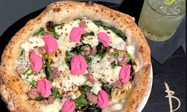 Pizza Popeye, one of the most popular at Gennaro Battiloro’s Battil'oro in Seravezza (Lucca), topping of «baby spinach, cinta senese sausage, toasted hazelnuts and mayonnaise of beetroot on a base of fiordilatte». The dough is classic, PetraViva with wheatgerm, sourdough, and 36 hours of leavening 
