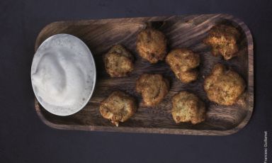 Salted cod cakes with honey at restaurant Compartir. It was opened in April 2012 in Cadaqués in Cataluña by Oriol Castro, Eduard Xatruch and Mateu Casañas. The restaurant’s concept is anticipated by the name itself: all dishes are to be shared. The success was so big, in 2014 the 3 guys also opened Disfrutar in Barcelona, "avantgarde with strong Mediterranean roots" (photo Francesc Guillamet)
