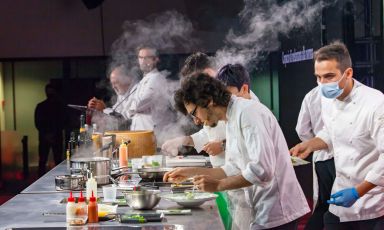 In the background, Carlo Cracco, the first speaker of the second day at #IdentitàMilano21. Close up, Luca Sacchi, chef at Cracco in Galleria
