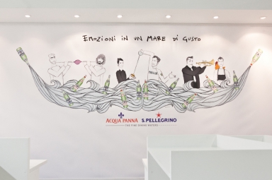 Nello stand, l'illustrazione di Gianluca Biscalchin con le coppie protagoniste degli incontri organizzati alla tavola di Acqua Panna e S.Pellegrino durante il congresso
