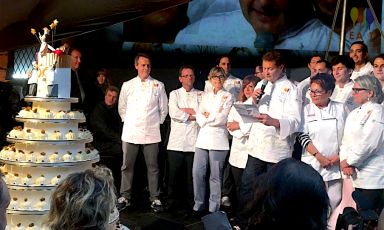 Enrico Cerea on stage with the cake for Da Vittorio’s 50th anniversary. The celebration also offered a chance to present Ea(s)t Lombardy, with the area becoming the 2017 European Region of Gastronomy