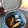 Best of the mussel. Mussels open in a pan with water of fermented barley. «We recreate the mussel», says Canella, «using just the flaps, the best part». The paste is made with scraps from the mussel, cooked in smoked butter

