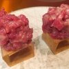 Cubo de wagyu. A cube of crispy potato chips topped with a wagyu tartare seasoned with oil, salt, Dijon mustard, eggs and pepper. A magnificent tapa 2 cm wide which recalls Piedmontese traditional hand chopped raw meat
