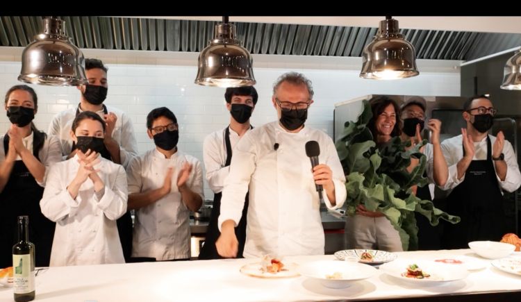 Massimo Bottura with his team at the end of the m