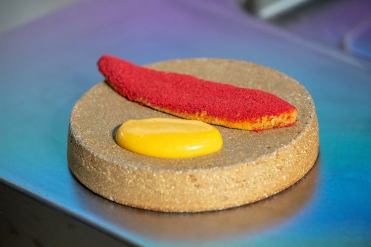 Surface of Mars is made with raspberry salt: it’s spread over a marinated plantain of buttermilk with sweet African flour, with an emulsion of smoked chilli pepper 
