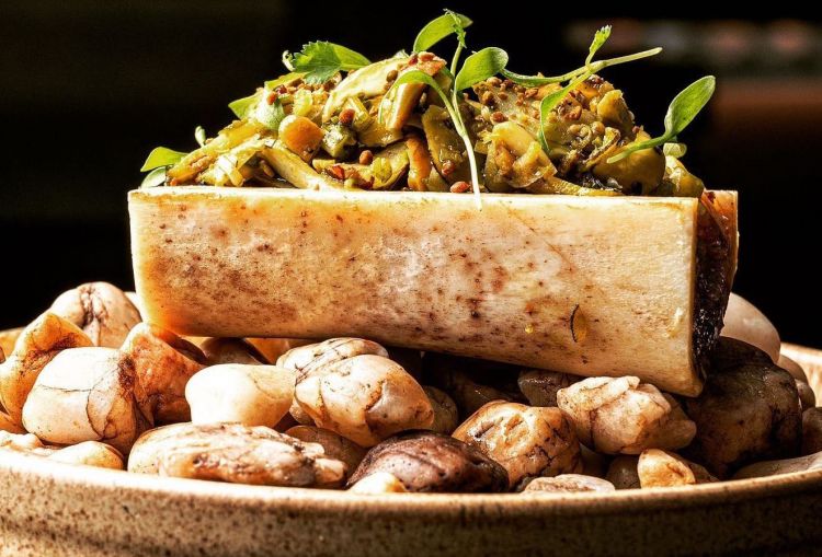 Bone marrow, tucupi and snails. Tucupi is the yellow juice extracted from peeled wild manioca roots, grated and pressed