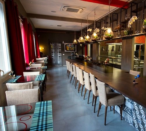 The dining room with the long table in the kitchen