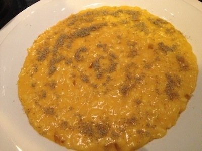 Risotto con crema di zucca arrostita, cardamomo e cedro candito