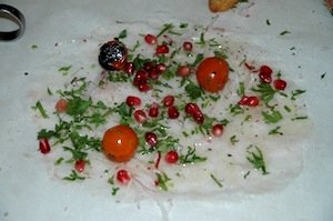 Fish carpaccio with pomegranates