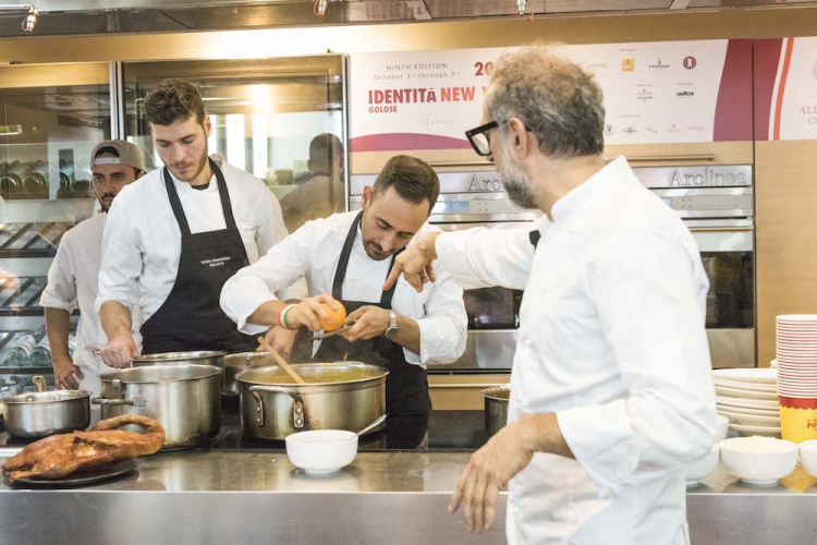 MAKE WAY FOR THE YOUNG GENERATIONS. Behind Bottura, his second Davide Di Fabio and Francesco Vincenzi, in the kitchen at Franceschetta 58
