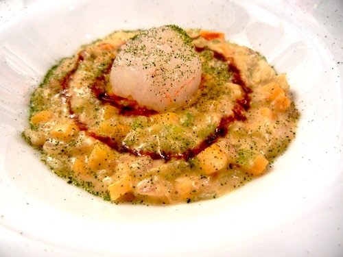 Fake risotto with vegetables with raw scampi and a caramel made with prawn heads