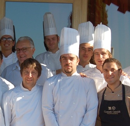 Dressed in black, Montalto posing together with Alain Ducasse and Christophe Martin