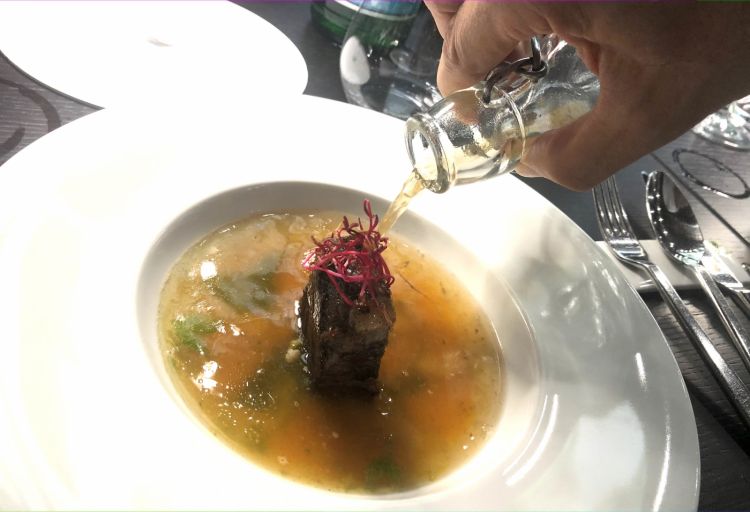 Grilled beef in beef stock, Kavcic's signature dish 
