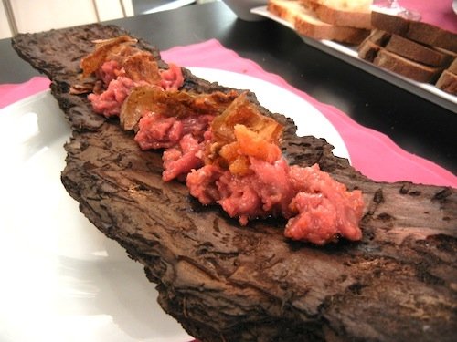 Garfagnana beef stracciata served on pine-bark