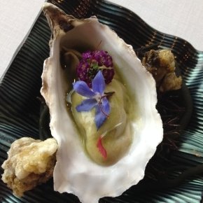 Seaside pil-pil oyster with slightly spiced flowers and anemones in a light tempura 