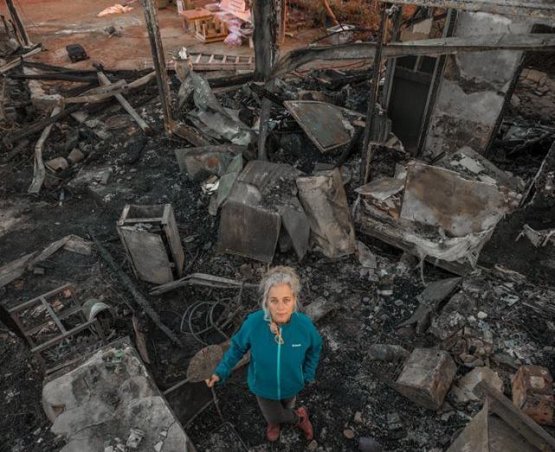 Rama Ben Zvi among the ruins of her restaurant
