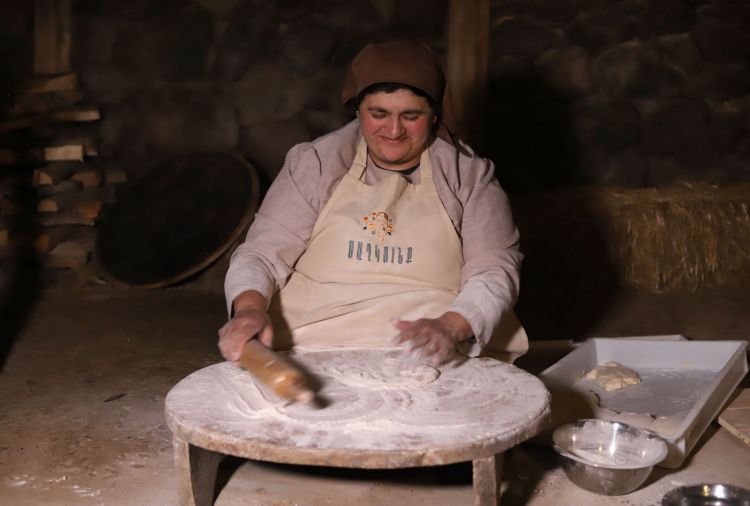 Also at Tsaghkunk, a woman rolling lavash
