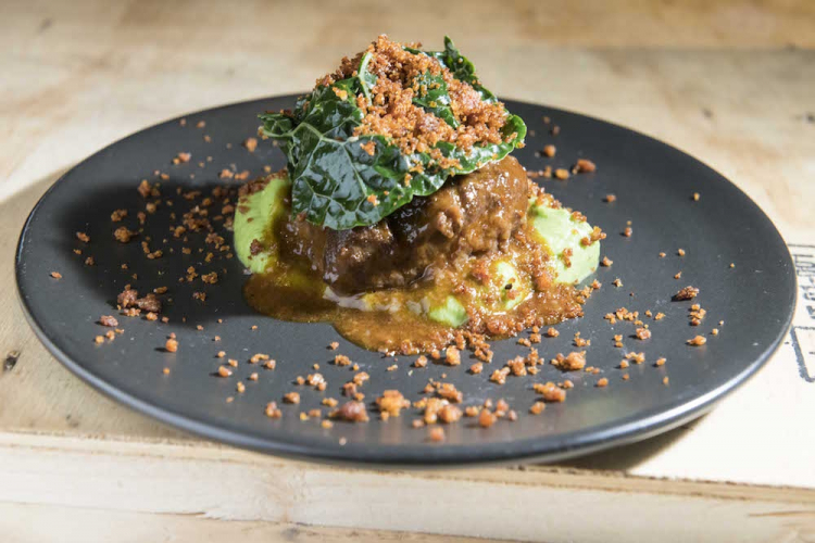 Glazed veal cheek with black cabbage, ‘nduja and ginger, by the team of Francesco Mazzei
