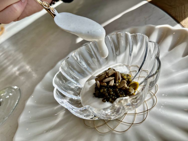 Oscietra caviar "Gold" lightly smoked, sunflower seeds, pickled walnut leaves & whipped cream
