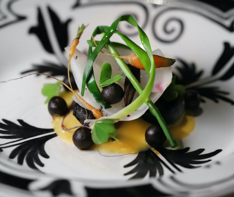 Stewed vegetables, corn sauce and black mole