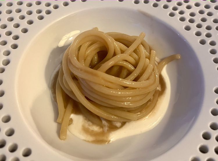 Mangiamaccheroni 
Spaghetti (which used to be called 'maccheroni') cooked in a broth of coffee, barley, acorns and tobacco, topped at the table with a cream of fermented buffalo milk. Lactic, spicy and a hint of truffle in the distance (which is not there)
