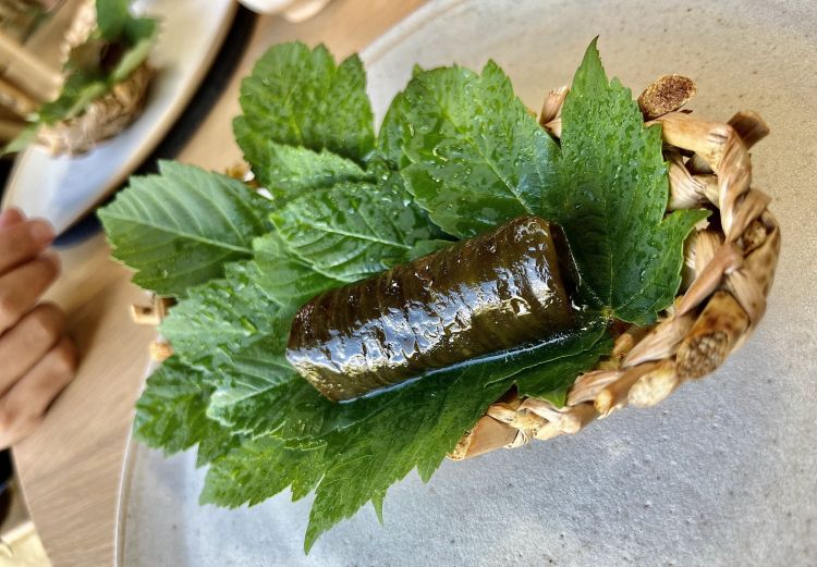 Cucumber skin dolma
A tart of koji grilled with a paste of pumpkin seeds, enclosed in a leaf of cucumber in the shape of a dolma. The Turkish-Greek-Middle Eastern-Caucasian custom of enclosing food (minced meat, or rice or wheat) in a leaf (usually of vine)
