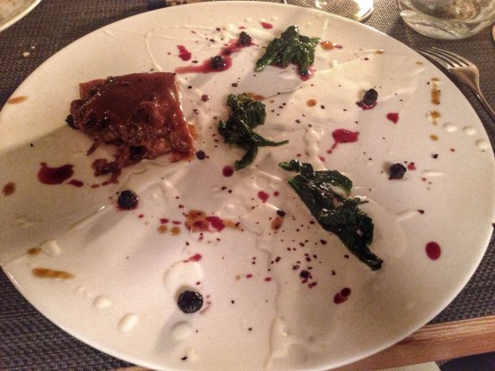 Goat glazed with fermented milk, spicy blueberries and rapini 