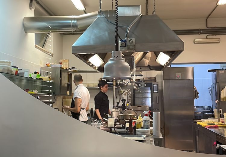 The kitchen at Arca, of siblings Massimiliano and Dalila Capretta, as seen from the dining room
