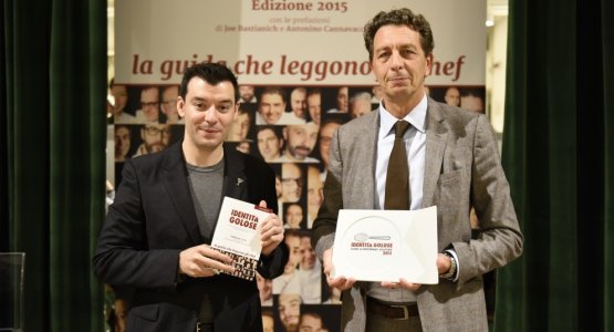 Nicola Cesare Baldrighi, on the right, president of Consorzio di Tutela del Formaggio Grana Padano, an important protagonist at IdentitàExpo. In this picture he's awarding Luca Fantin as Identità Golose's best chef 2015