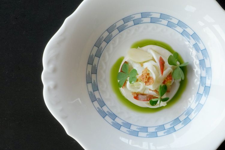 Seasalad: cuttlefish processed with ultrasound (to soften the fibres) and then cooked at low temperature. Served with chopped tomatoes, fig oil and roasted almond cream