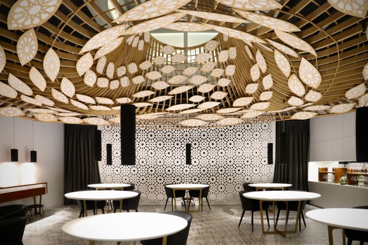 The dining room at Noor: one room, 8 tables, open view kitchen