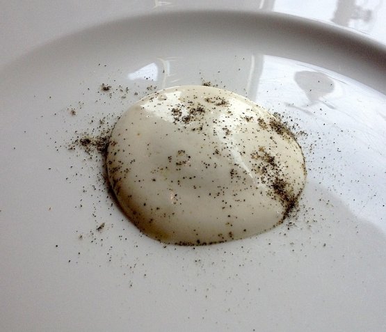 Butter and sage: sage is a caramelized powder and the hidden raviolo is liquid
