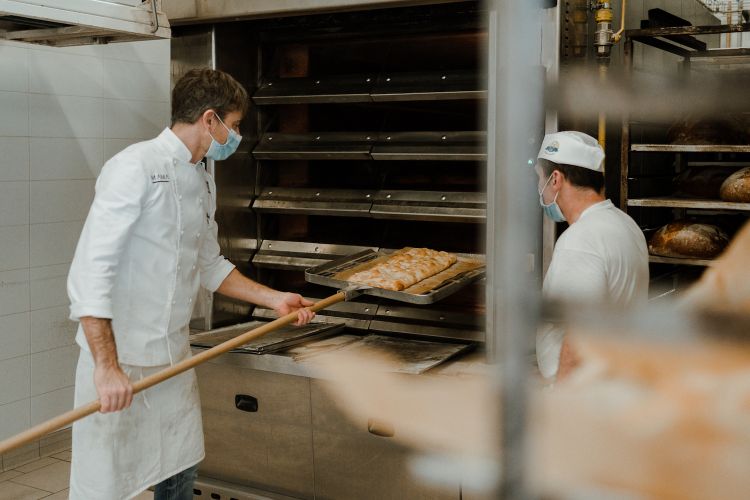 Davide Quaglia at work pre-cooking the pizza 
