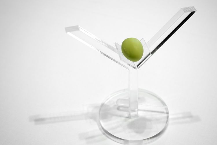 We start with Dry Martini, in a fake olive

