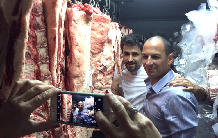 A close up of Pablo Rivero, patron at Don Julio in Buenos Aires. Behind him, chef Guido Tassi who also contributes to the success of this excellent chargrilled meat restaurant
