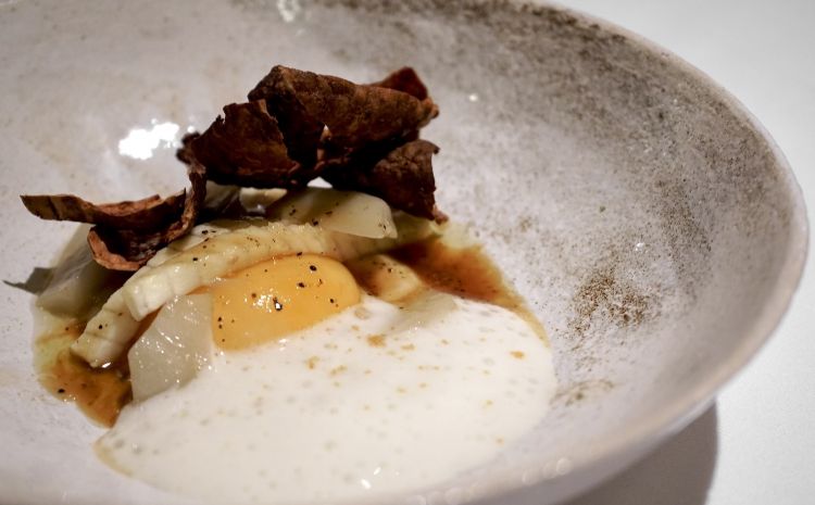 Egg yolk cooked at low temperature and Jerusalem artichoke in different textures with jus of chicken and truffle, hazelnut butter, smoked eel, mousse of eel and matured eel roe (2020)
