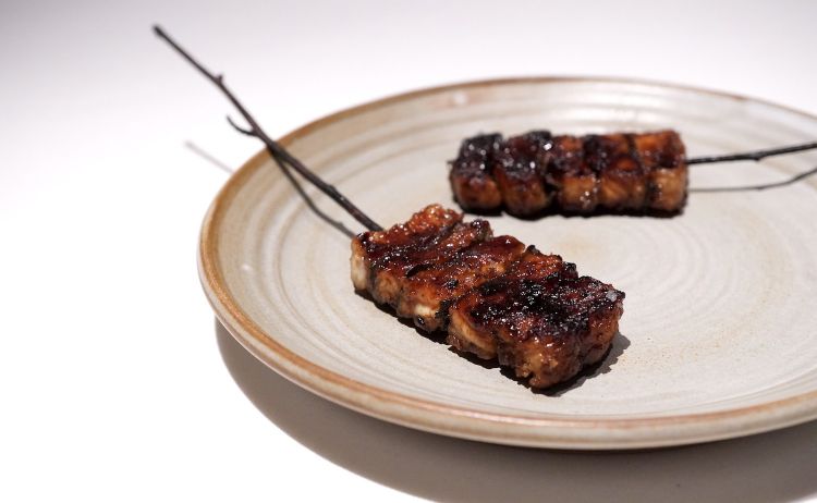 Another marvel: Glazed eel & smoked broth. The glazing is with honey, soy sauce and sage. On the side, a broth made with what’s discarded of the eel, toasted, with lemon balm, mint, verbena and nasturtium 
